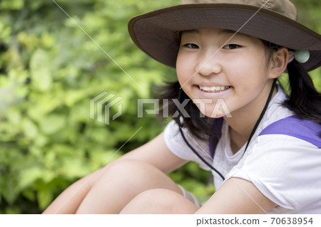 Trekking image: A child sitting and taking a break Trekking image: A child sitting and taking a break 70638954