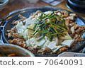Stir-fried leek giblets on a stone plate 70640091