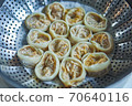 Kimchi dumplings cooked in a steamer 70640116