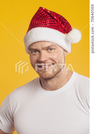 portrait of man in santa claus hat and present box portrait of man in santa claus hat and present box 70640569