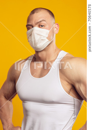 Studio portrait of man in a medical mask Studio portrait of man in a medical mask 70640578