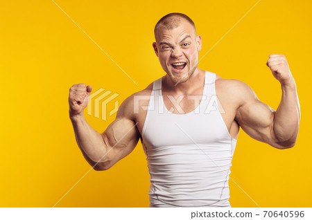 Closeup portrait of muscular man in white shirt 70640596