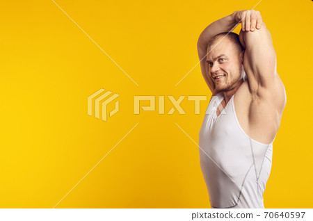 Closeup portrait of muscular man in white shirt 70640597