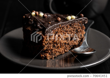 Piece of chocolate cake 70641451