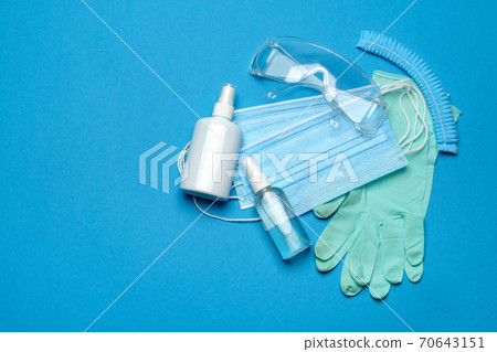 Safety equipment to fight to Coronavirus COVID-19 virus outbreak - Safety mask, hand sanitizer, latex gloves and protective glasses or goggles Safety equipment to fight to Coronavirus COVID-19 virus outbreak - Safety mask, hand sanitizer, latex gloves and protective glasses or goggles 70643151