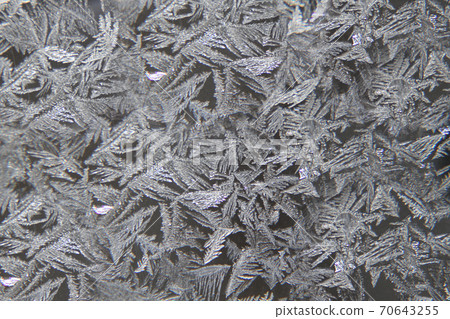 Frost pattern on the glass surface .Texture or background 70643255