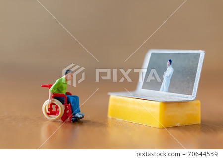 Male patient talk consult with doctor using video call on laptop , online doctor concept Male patient talk consult with doctor using video call on laptop , online doctor concept 70644539