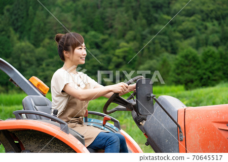 Tractor and women 70645517