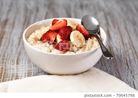 prepared oatmeal with fruits and berries prepared oatmeal with fruits and berries 70645798