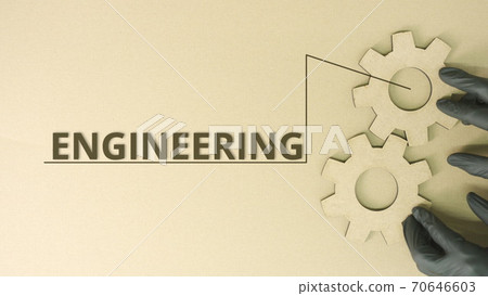Cardboard cogwheels and Engineering word Cardboard cogwheels and Engineering word 70646603
