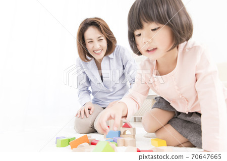 Mother and daughter playing with blocks 70647665