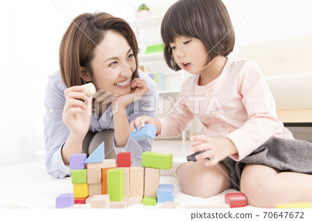Mother and daughter playing with blocks 70647672