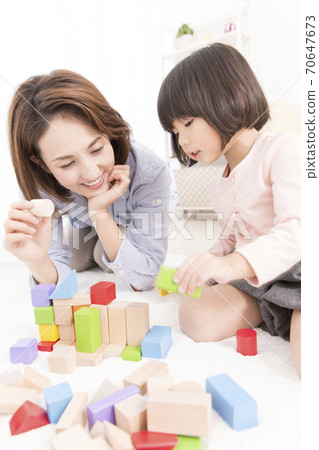 Mother and daughter playing with blocks 70647673