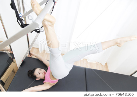 woman doing pilates woman doing pilates 70648100