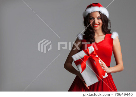 Girl with christmas gift box Girl with christmas gift box 70649440