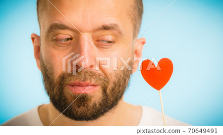 Adult man with heart on stick 70649491