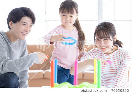Family Parents and children playing with quoits 70650290