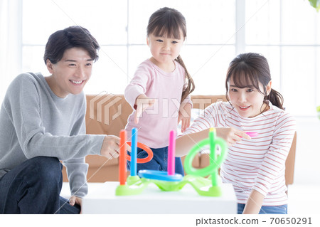 Family Parents and children playing with quoits 70650291