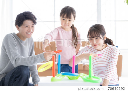 Family Parents and children playing with quoits 70650292