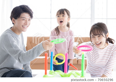 Family Parents and children playing with quoits 70650296