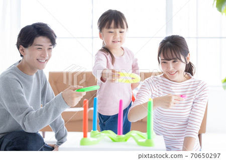 Family Parents and children playing with quoits 70650297