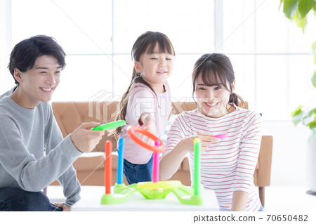 Family Parents and children playing with quoits Family Parents and children playing with quoits 70650482