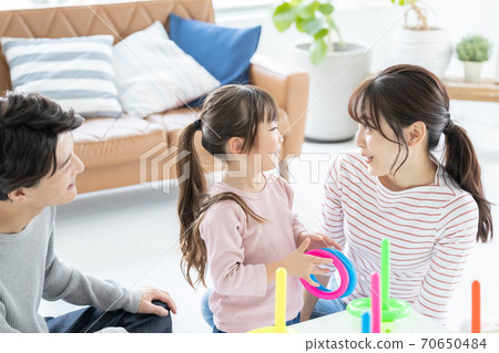 Family Parents and children playing with quoits 70650484