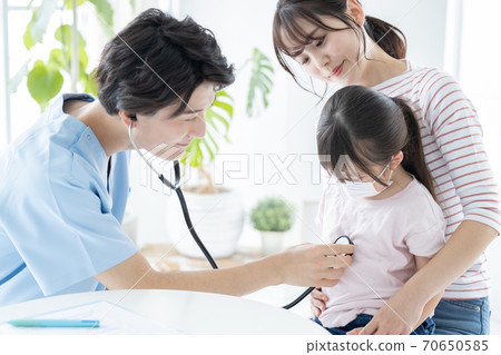 Girl undergoing medical examination Girl undergoing medical examination 70650585