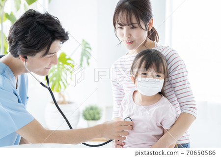 Girl undergoing medical examination Girl undergoing medical examination 70650586
