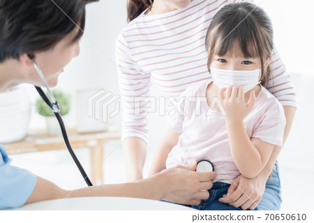 Girl undergoing medical examination Girl undergoing medical examination 70650610