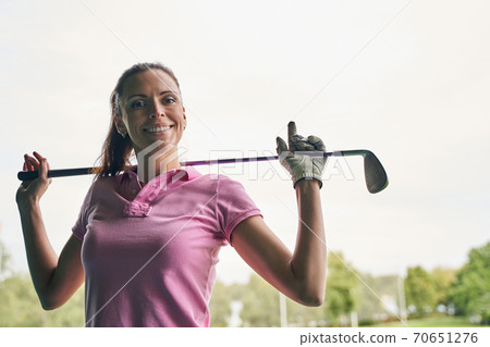 Happy Caucasian golfer with a beaming smile Happy Caucasian golfer with a beaming smile 70651276