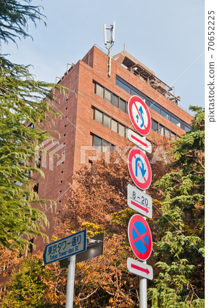 Various traffic signs in the traffic pole near Tokyo Tower-dori street in the morning. There is nobody in the photo. 70652225