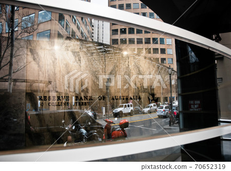 Reserve Bank of Australia name on black granite wall in Melbourne Australia with a reflection of high-rise buildings Reserve Bank of Australia name on black granite wall in Melbourne Australia with a reflection of high-rise buildings 70652319