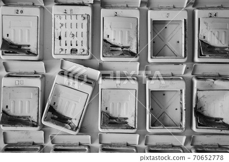 Abandoned Old Classic Broken Letterboxes in a Row 70652778
