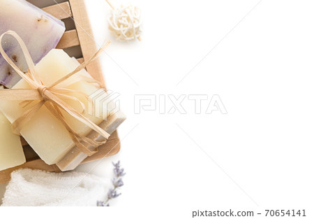 Homemade natural Soap bars on wooden soap dish, over white background. 70654141