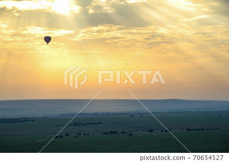 Kenya Masai Mara National Park in June Hot air balloon floating in the sunrise Kenya Masai Mara National Park in June Hot air balloon floating in the sunrise 70654527