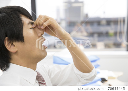 Tired eyes businessman Tired eyes businessman 70655445