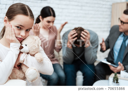 A man grabbed his head while discussing problems. 70655866