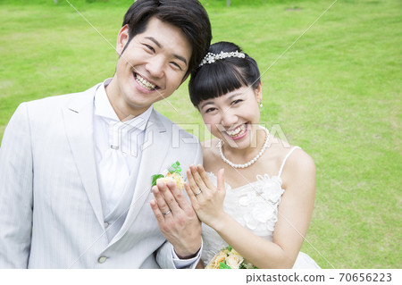 A smiling bride and groom 70656223