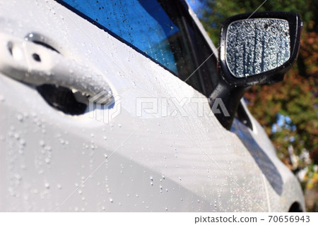 Water droplets from car wash rinsing Water droplets from car wash rinsing 70656943