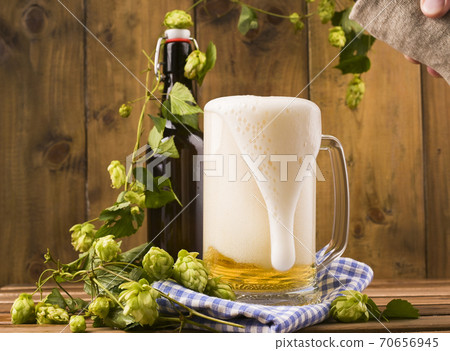 Beer. Pint of Beer close up on a wooden background. Cold Craft light Beer in a glass with water 70656945