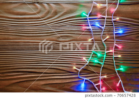 Christmas lights on dark wooden background flat lay mockup frame for greeting card 70657428