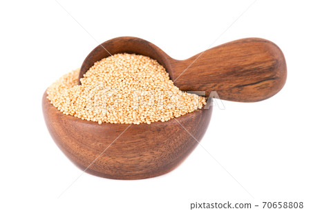 Amaranth seeds in wooden bowl and spoon, isolated on white background. Organic dry raw amaranth beans. 70658808
