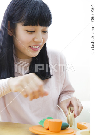 Mother playing with toys Mother playing with toys 70659564