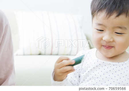 Infants playing with toys Infants playing with toys 70659566