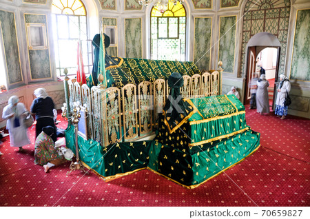 Bursa, Turkey - 25 June 2011: People visit Emir Sultan Tomb at EmirSultan Complex or Sultan Complex a mosque complex in Bursa Bursa, Turkey - 25 June 2011: People visit Emir Sultan Tomb at EmirSultan Complex or Sultan Complex a mosque complex in Bursa 70659827
