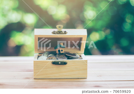 Coins and house are in treasure chests. indicate savings to buy a home. planning savings money of coins to buy a home concept for property, mortgage and real estate investment or saving for a house. Coins and house are in treasure chests. indicate savings to buy a home. planning savings money of coins to buy a home concept for property, mortgage and real estate investment or saving for a house. 70659920