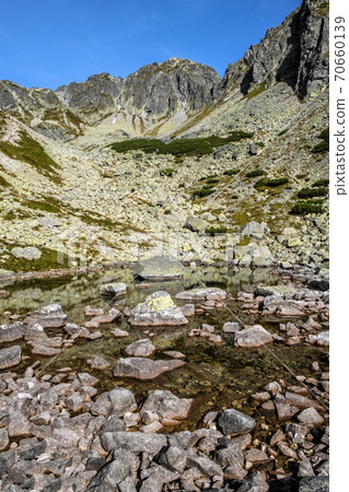 Red tarn, High Tatras mountains, Slovakia Red tarn, High Tatras mountains, Slovakia 70660139