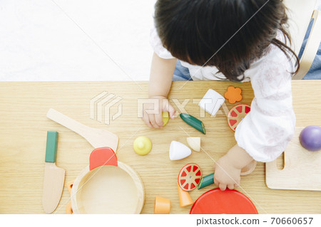 Girl playing house Girl playing house 70660657