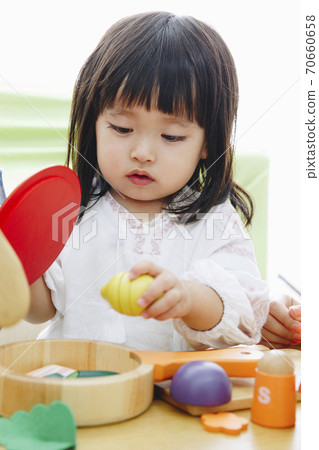 Girl playing house Girl playing house 70660658